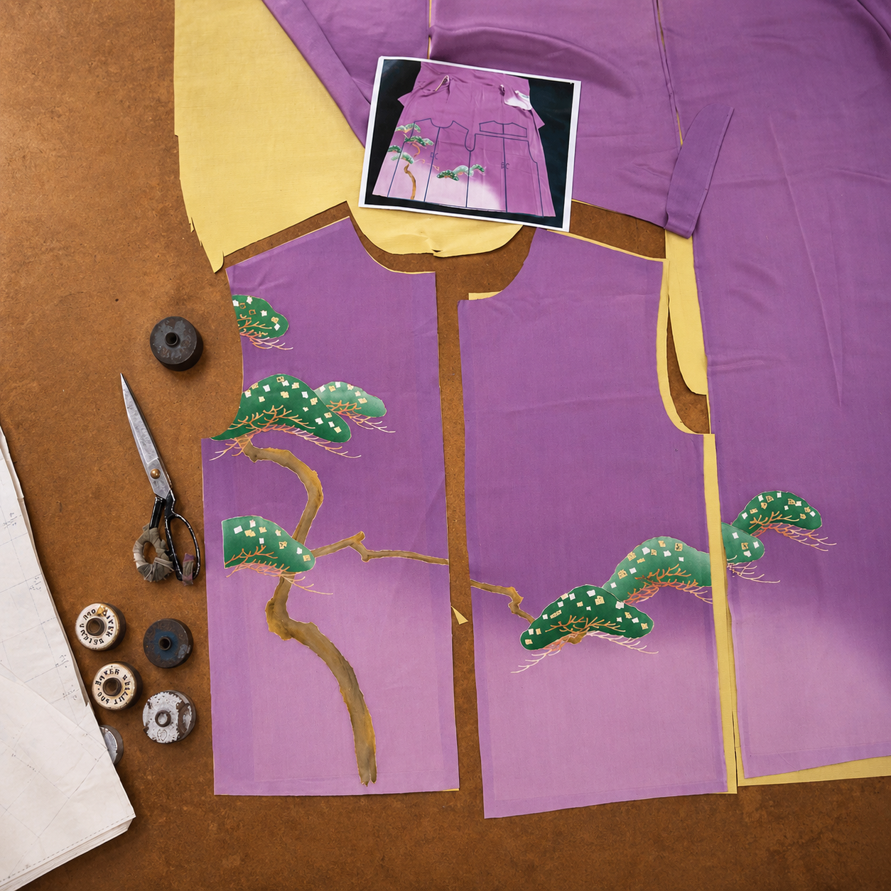 Carefully placing the kimono artwork before cutting each pattern